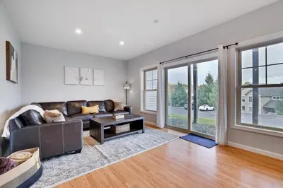 a living room with a couch and a table at Mountain Chalet Ski, Hike, & Explore in Tannersville
