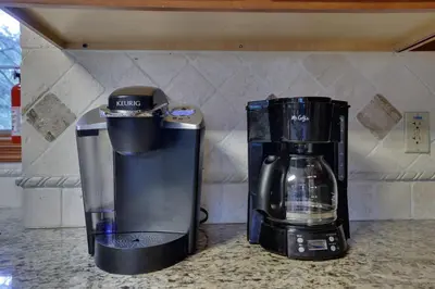 a coffee maker and a blender on a counter at Harmony Haven Large Deck Hot Tub Ski in Split Rock