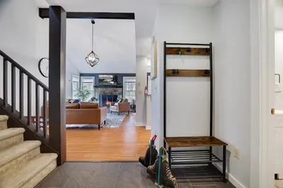 a hallway with a door leading to a living room at Spruce Ridge Lodge Ski, Hike & Relax in Tannersville