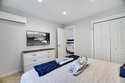 a bedroom with a bed with towels on it at Spruce Ridge Lodge Ski, Hike & Relax in Tannersville