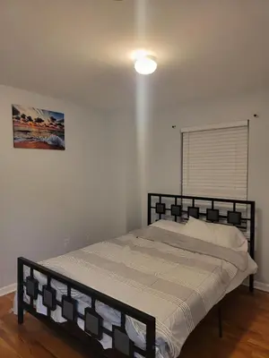 a bedroom with a bed in a room at Urban Nest in Newark
