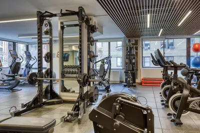 a gym with treadmills and tread machines at Blueground Upper West Side fitness nr Central Park NYC-1994 in New York