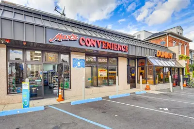 a store in a parking lot in front of a store at Easy NYC Commute Guttenberg Getaway Near Parks in Guttenberg