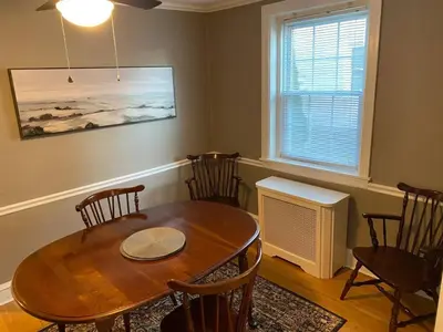 a dining room with a table and chairs and a window at Bryn Mawr Spacious Grnd Floor Apt Free Parking in Bryn Mawr