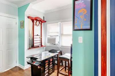 a room with blue and white walls and a desk at Gythio in Keansburg