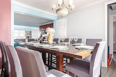 a dining room with a table and chairs at Gythio in Keansburg