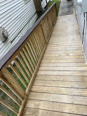 a wooden walkway leading up to a house at Odessa in Keansburg
