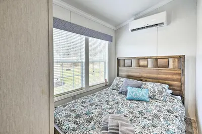 a bedroom with a bed and a window at Romantic Escape Cottage and Suites Close to Ski Trails in Pleasant Mount