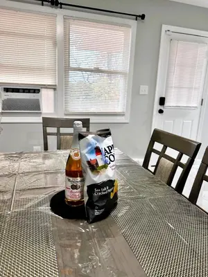 a table with two bags of food on it at Peaceful 3BR House w Easy NYC Access in South River, NJ in South River