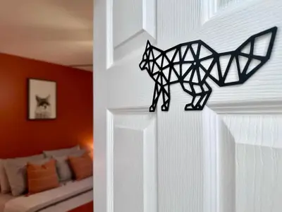 a black cat decoration on the wall of a bedroom at Pocolonial Charming 4BR Mountain Retreat in Albrightsville