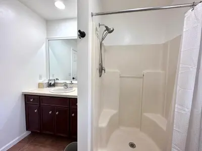 a bathroom with a tub and a sink and a shower at Pocolonial Charming 4BR Mountain Retreat in Albrightsville
