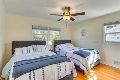 a bedroom with two beds and a ceiling fan at Spacious Fanwood Home with Decks, Walk to Park!