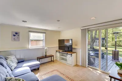 a living room with a couch and a tv at Spacious Fanwood Home with Decks, Walk to Park!