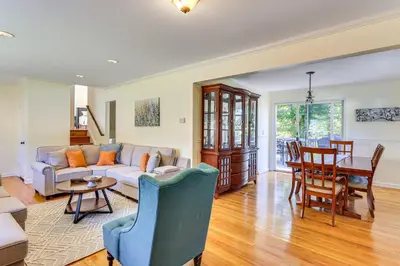 a living room with a couch and a table at Spacious Fanwood Home with Decks, Walk to Park!