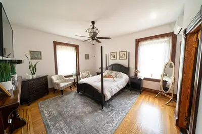 a bedroom with a bed and a ceiling fan at The Willough in Conshohocken