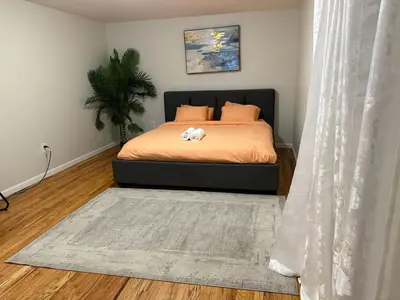 a bedroom with a bed with a stuffed animal on it at Urban haven 3 Kings bedroom near EWRNYC DTW in Newark