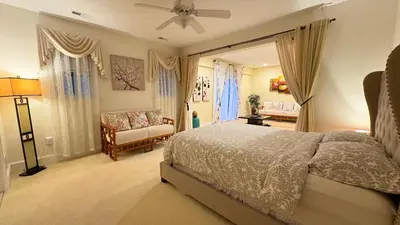 a bedroom with a bed and a couch in it at Spacious Guest Suite 5 Minutes to Princeton University with Free Parking in Princeton