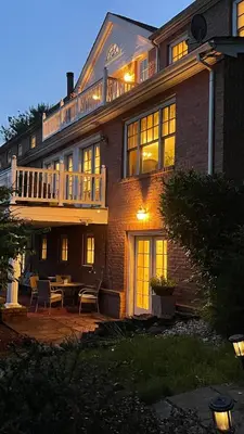 a large brick house with a deck and a patio at Spacious Guest Suite 5 Minutes to Princeton University with Free Parking in Princeton