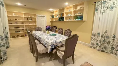 a dining room with a table and chairs and shelves at Spacious Guest Suite 5 Minutes to Princeton University with Free Parking in Princeton