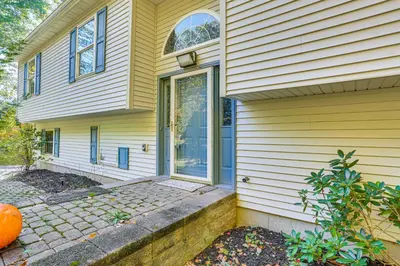 a front door of a house with an orange pumpkin at Hike, Ski and Explore Otisville Retreat with Yard! in Otisville