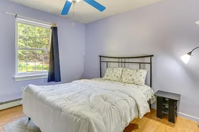a bedroom with a bed and a window at Hike, Ski and Explore Otisville Retreat with Yard! in Otisville