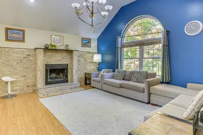 a living room with a couch and a fireplace at Hike, Ski and Explore Otisville Retreat with Yard! in Otisville
