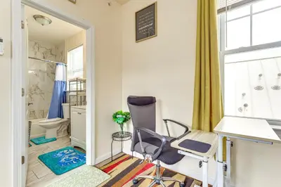 a home office with a chair and a desk at Quiet Newark Apt Near Colleges, Arenas and Hospitals in Newark