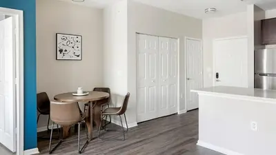 a kitchen and dining room with a table and chairs at Landing Spectacular 2BD Clubhouse Pool in King of Prussia