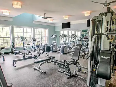 a gym with several treadmills and exercise bikes at Landing Spectacular 2BD Clubhouse Pool in King of Prussia