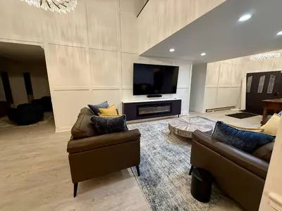 a living room with two couches and a flat screen tv at Top Luxe Oasis -Ski, Hike, Firepit, Spa, Golf in Vernon Township