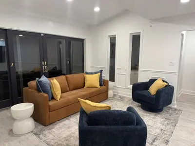 a living room with a couch and two chairs at Top Luxe Oasis -Ski, Hike, Firepit, Spa, Golf in Vernon Township