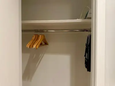 a closet with two umbrellas on a rack at The Marquee House in New York