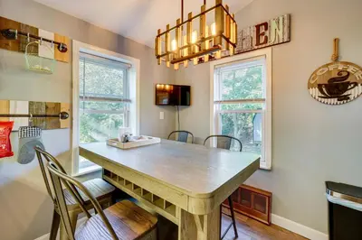 a dining room with a wooden table and chairs at Little Woodland Home Hidden Gem By Dtwn Bethlehem in Bethlehem