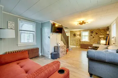a living room with a couch and a chair and a living room at Little Woodland Home Hidden Gem By Dtwn Bethlehem in Bethlehem