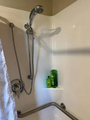 a bathroom with a shower and a sink at Rutland Hill Farmhouse in Mansfield