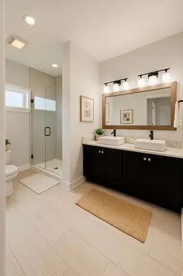 a bathroom with two sinks and a shower at Modern Riverfront Rowhome, Walk to Fishtown in Philadelphia