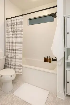 a bathroom with a tub and a toilet and a sink at Modern Riverfront Rowhome, Walk to Fishtown in Philadelphia