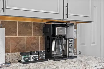 a coffee maker on a counter in a kitchen at Pocono Lake Escape, includes Golf Cart, Firepit in Pocono Lake