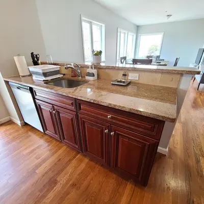 a kitchen with a sink and a counter top at Spacious Apt in Fairview NJ Easy Commute to NYC with parking in Fairview