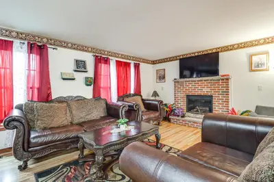 a living room with leather furniture and a fireplace at Less Than 1 Mi to Lake Family Home in Albrightsville! in Albrightsville