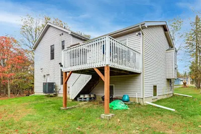 a house with a deck on the side of it at Less Than 1 Mi to Lake Family Home in Albrightsville! in Albrightsville