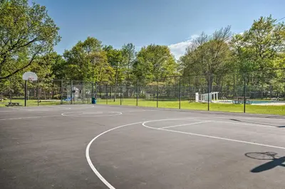 a basketball court in a park with a fence at Less Than 1 Mi to Lake Family Home in Albrightsville! in Albrightsville