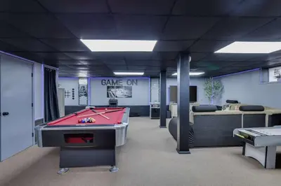 a room with a pool table and a room with a game office at The Playhouse Retreat Large Game Room Fire Pit in Tobyhanna