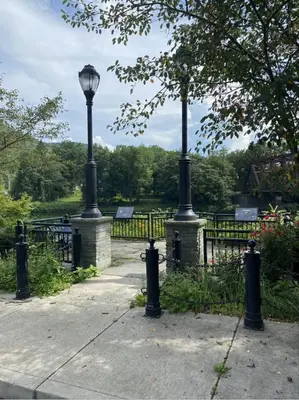 a park with a lamp post and a fence at Smith's Colonial Motel in Hancock