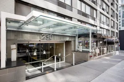 a store front of a building with glass windows at Blueground Midtown East rooftop nr Bryant Park NYC-2070 in New York