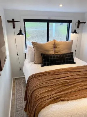 a bedroom with a large bed with a large window at Tioga Ridge Lookout I Near Tioga-Hammond Lake