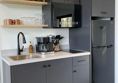 a kitchen with a sink and a refrigerator at Tioga Ridge Lookout I Near Tioga-Hammond Lake