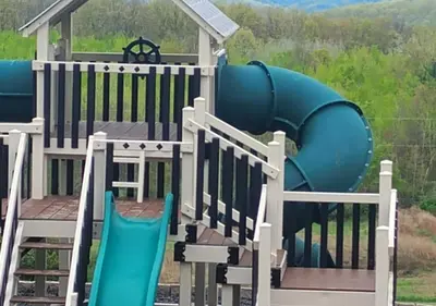 a playground with an inflatable slide on a deck at Tioga Ridge Lookout I Near Tioga-Hammond Lake