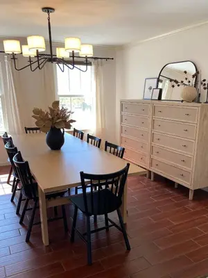 a dining room with a table and chairs and a dresser at 11-Acre Retreat I Firepit, Pickleball and Nature