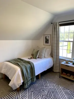 a bedroom with a bed and a window at 11-Acre Retreat I Firepit, Pickleball and Nature